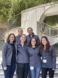 Postdocs wearing new lab jackets