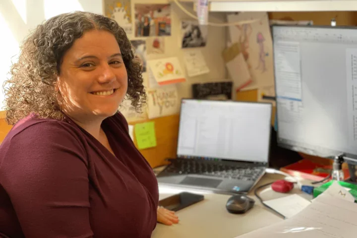 Bethan Popjak sitting at desk