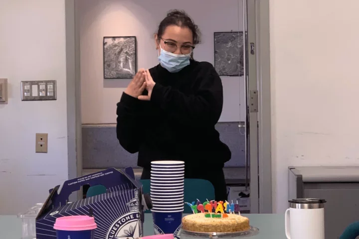 Maria Taveras, selected as a Dean's Prize Winner, with cake