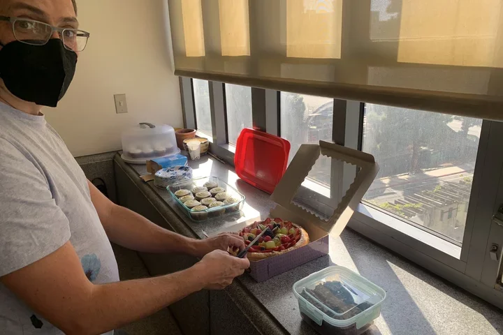 Man cutting a cake