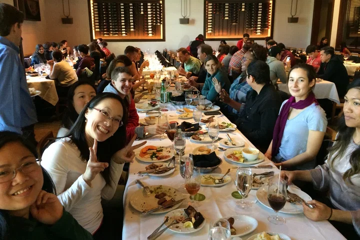 Group enjoying food at restaurant table