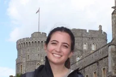 Sofia standing next to castle