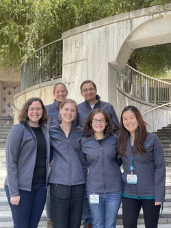 Postdocs wearing new lab jackets