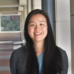 Elinor Lee standing in hallway outside building