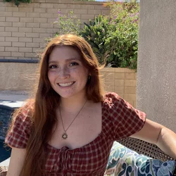 Gabriella Rubert sitting outside in front of pool